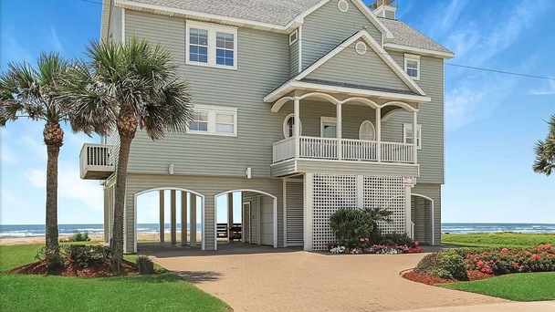 Exterior shot of a multi-level home with see through ocean view.